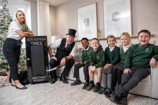 Jodie from Barratt Homes with Mark Fraser and some pupils from Priors Hall ALC.