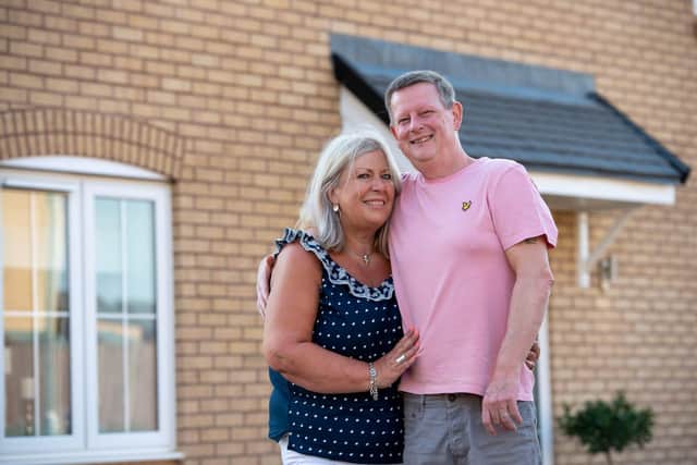 Tracey and Mark Earwaker outside their new four-bedroom home