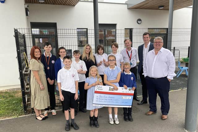 The cheque was handed over to Red Kite Academy