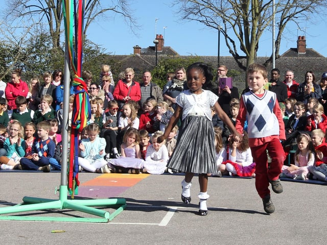 Hawthorn Community Primary School, 2013 May Queen Shekiana Amoateng and May King Thomas Schloesser dance around the maypole