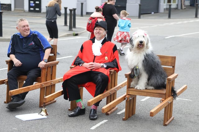 Corby Radio's Des Barber with town crier Anthony Dady (and dog) in the ceremonial chairs