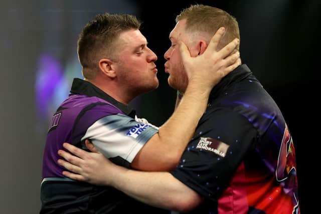 Daryl Gurney celebrated winning his round three match against Ricky Evans by landing a smacker on his lips! (Picture: by Tom Dulat/Getty Images)