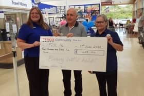Tesco staff hand over their cheque to Friends of S&L 14