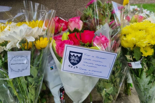 Messages left to in The Queen's memory at Higham Ferrers war memorial