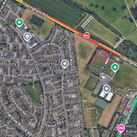 Corby main road closed after emergency services called to crash