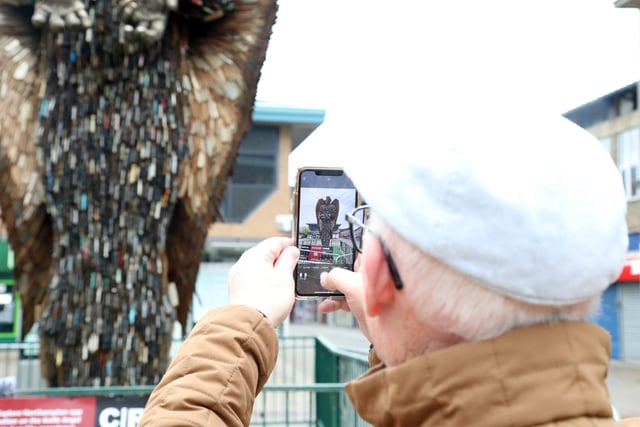 A resident takes a photo of the Knife Angel on a visit to Corporation Street on Sunday