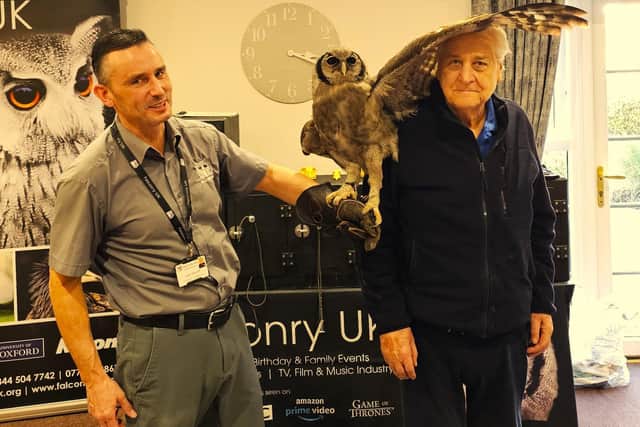Jason from Falconry UK with brave Elm Bank Care Home in Kettering resident.