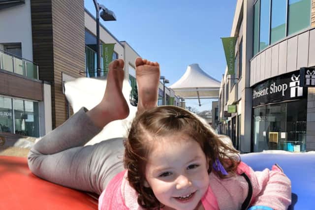 There'll be a giant inflatable obstacle course in Queen's Square tomorrow. Illustrative images: NationalWorld / Getty