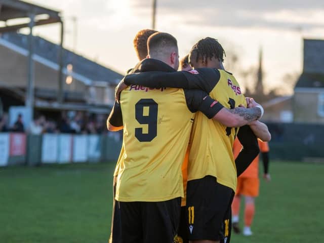 Jenson Cooper takes the congratulations after he opened the scoring in AFC Rushden & Diamonds' 2-1 win over St Ives Town on Monday. Picture by Hawkins Images