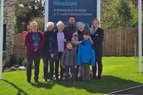 (L-R) Blooming Oundle members Helen Shair, Finola Stovin, Myra Hales, Simon Jones, with sons Caleb and Ethan Jones, and Julie Wade Wallace, alongside Beth, Bovis Homes sales advisor at Cotterstock Meadows in Oundle