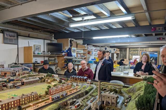 Chris Curtis, MP for MK North, accompanied by James Lancaster, Deputy Mayor of Milton Keynes watching model train display during their visit this year (2025)