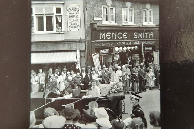 Wellingborough Carnival processes past Mence Smith and Saxby's in Market Street