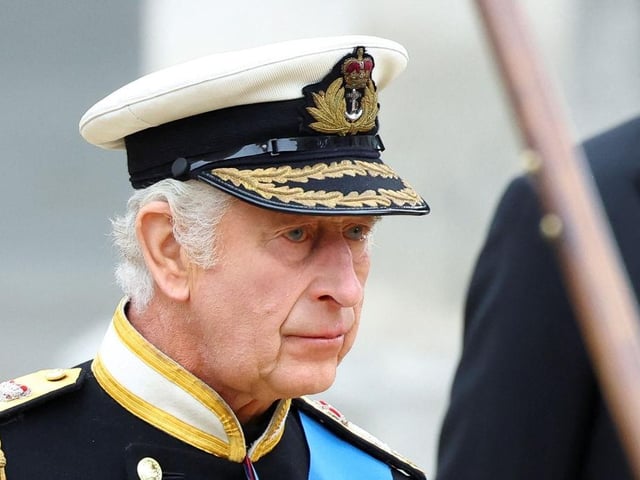 King Charles III follows the coffin of his late mother, Queen Elizabeth II, towards Westminster Abbey