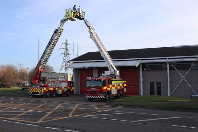 Ladders form an arch at Corby fire station