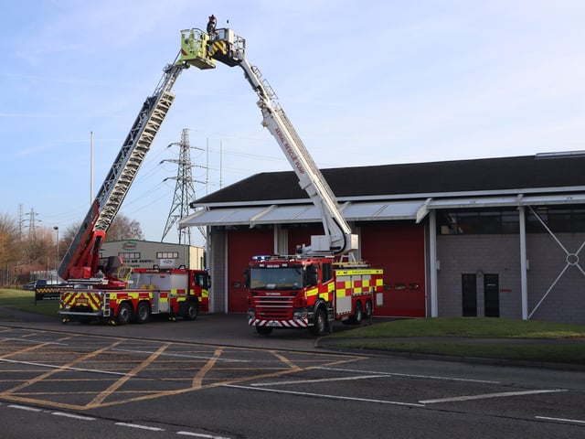 Ladders form an arch at Corby fire station