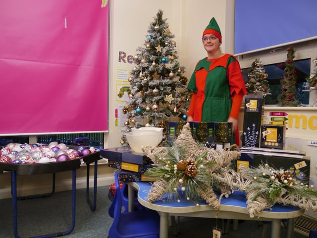One of Santa's elves ready with the Christmas items