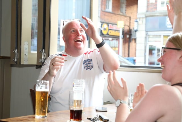 Fans celebrate England scoring in extra time