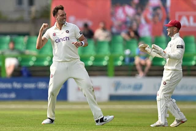 Harry Conway celebrates the dismissal of Leicestershire's Ian Holland