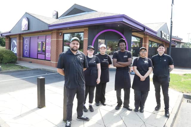 Taco Bell Kettering team members on the opening day with left Gabriel Bradu manager and area manager Russell Mayes on right /IMG