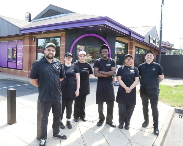 Taco Bell Kettering team members on the opening day with left Gabriel Bradu manager and area manager Russell Mayes on right /IMG