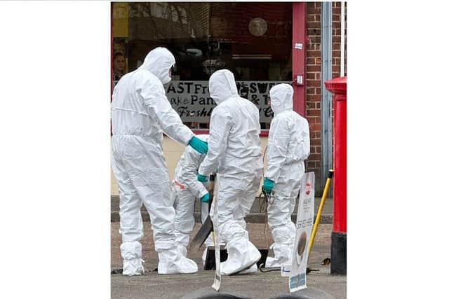 Forensics officers in Corby. Image: Patrick McMillan