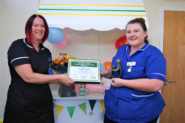 Midwife Emma Duxon receives the Daisy award from Deputy Director of Nursing Pam Smith at Kettering General Hospital