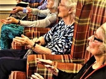 Residents taking part in arm chair exercises