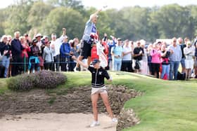 Charley Hull celebrates after chipping in from the bunker for eagle on the 11th hole in the final round of the AIG Women's Open. Pictures by Warren Little/Getty Images