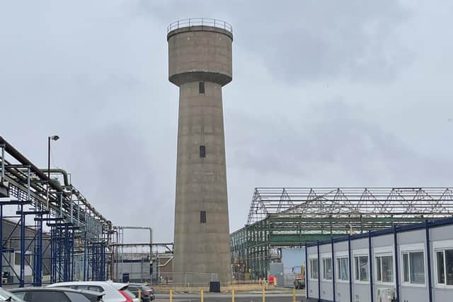 This iconic water tower at the steelworks will be retained - but the building to the right of the picture is already being demolished