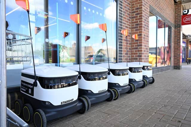 Five robots lined up