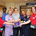 ED Pastors Margaret Bell and Esther Hall handing out chocolates to members of the A&amp;E team