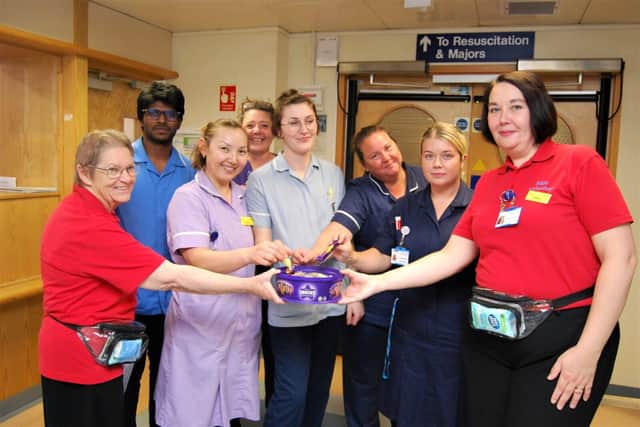 ED Pastors Margaret Bell and Esther Hall handing out chocolates to members of the A&amp;E team