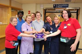 ED Pastors Margaret Bell and Esther Hall handing out chocolates to members of the A&amp;E team