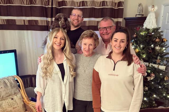 Tash (front left) with family - Mum Frances, dad John, husband Jet, and sister Alex.