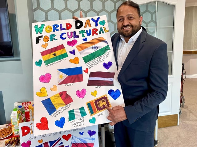 Hari pointing proudly to his flag
