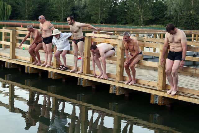 Wicksteed Park’s newly restored lake hosts Kettering Amateur Swimming Club for their anniversary celebration swim.
Members of the club recreate a 1920s photo of KASC members about to jump into Wicksteed Lake.
l-r John Withpetersen, Tom Reed, Don Ward (president), Allan Withpetersen, Richard Harmer, Roger Patrick, Rob Mitchell