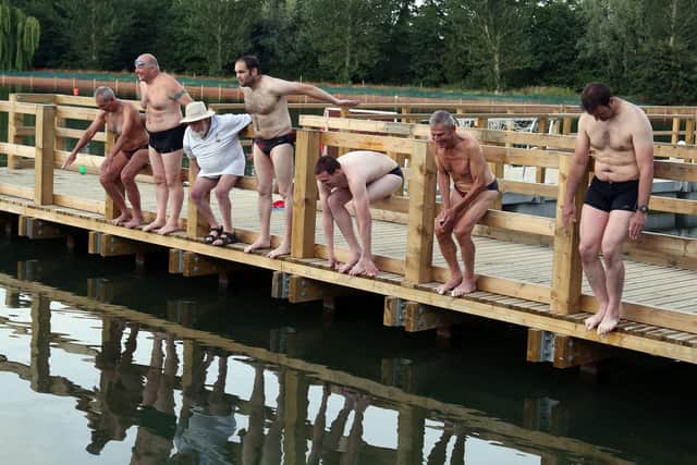 Wicksteed Park’s newly restored lake hosts Kettering Amateur Swimming Club for their anniversary celebration swim. 
Members of the club recreate a 1920s photo of KASC members about to jump into Wicksteed Lake. 
l-r John Withpetersen, Tom Reed, Don Ward (president), Allan Withpetersen, Richard Harmer, Roger Patrick, Rob Mitchell