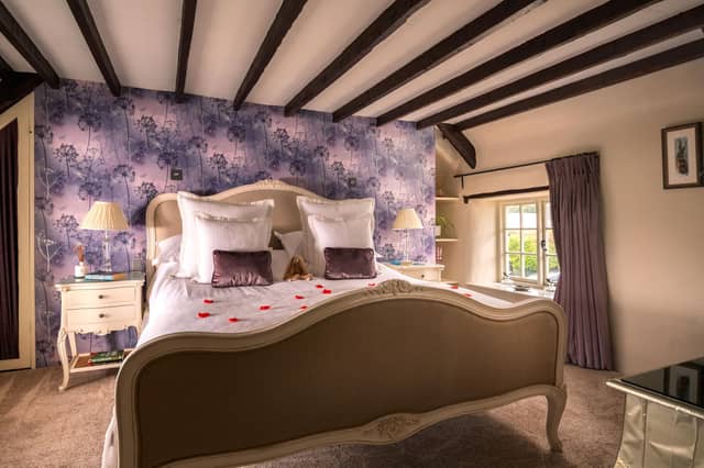 Master bedroom with loving red roses on the duvet