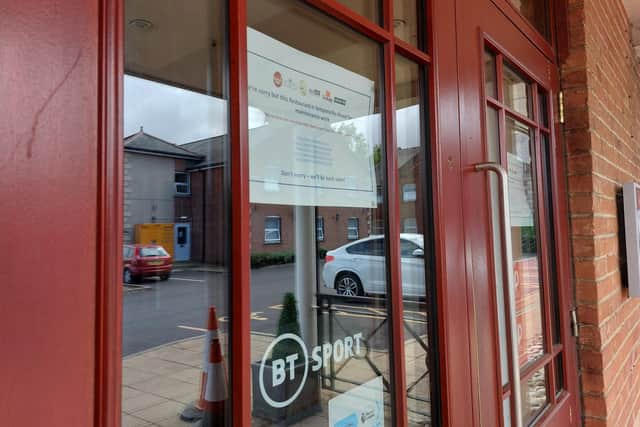 A notice on the door says essential maintenance is taking place