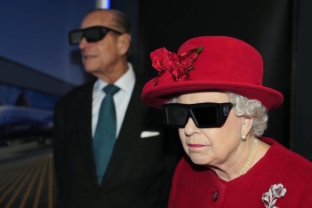 The Queen and the Duke of Edinburgh wearing 3D glasses to watch a display and pilot a JCB digger during a visit to the University of Sheffield Advanced Manufacturing Research centre in May, 2012, the Queen's Diamond Jubilee year