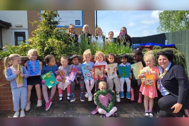 Staff and pupils celebrate the rating.