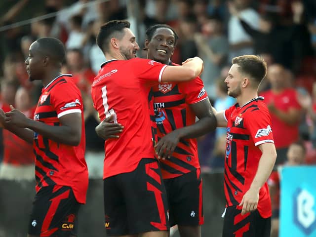 Nile Ranger is congratulated after firing the Poppines into the lead against Leiston (Picture: Peter Short)