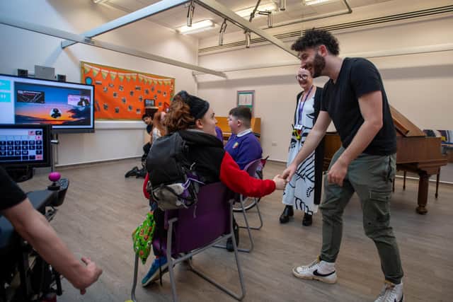 Billy Lockett visiting Greenfields Specialist School For Communication to donate the piano he wrote his debut album on. Photo by David Jackson.
