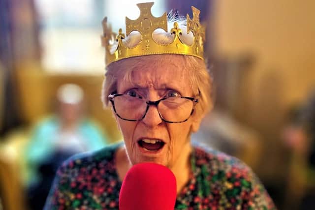 A resident singing along to the karaoke.