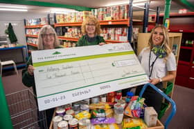 Jane Calcott (L) and Jane Stone at Kettering Foodbank with Sales Adviser Tenise