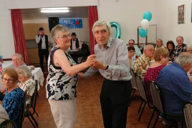 Islip Club steward Terry Gunn presents cheque for £1722 to Cando Care MD Kathleen Meredith