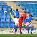 Ollie Banks heads home Chesterfield's first goal against the Poppies (Picture: Peter Short)