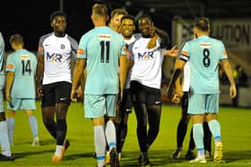 Khristopher Oti celebrates one of his goals after he hit a hat-trick in Corby Town's big 6-0 win at Rugby Town on Tuesday. Picture by Jim Darrah
