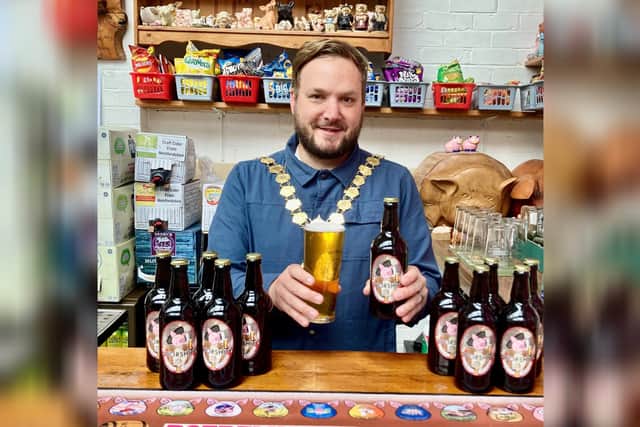Cllr Craig Skinner with the specially-brewed beer.