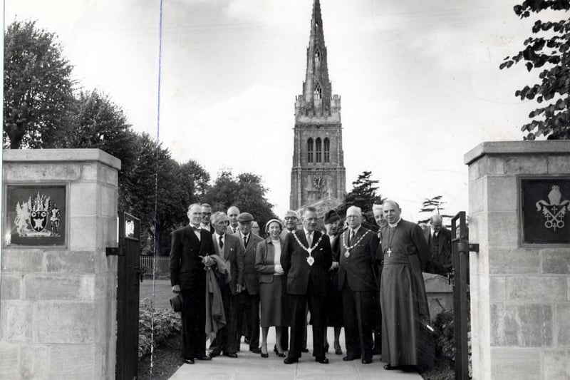 The Bishop of Peterborough with guests open the garden at Kettering Parish Church in 1960.